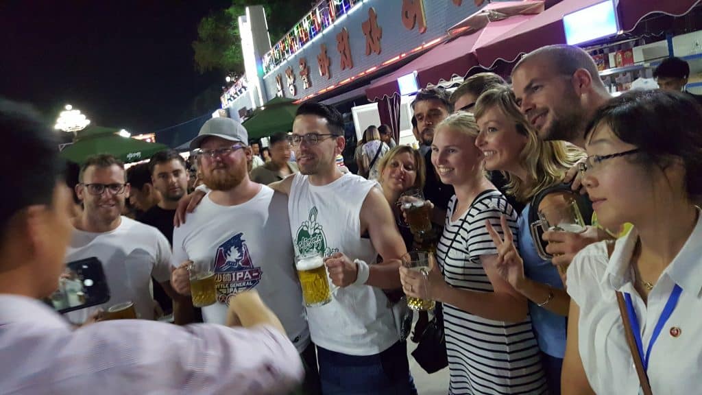 tourists at the Pyongyang beer festival on a North Korea tour