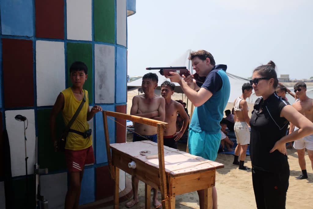 tourist at a beach shooting range on a north korea tour