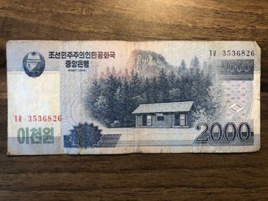 North Korean currency, 2000 won note showing birthplace of Kim Jong Il