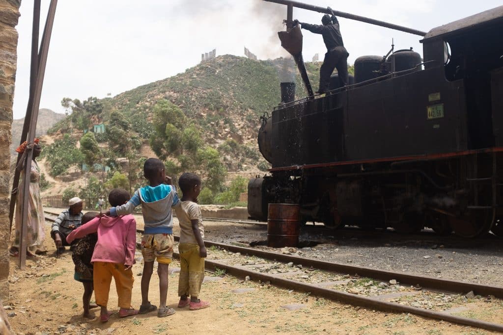 local kids beside a train in Eritrea