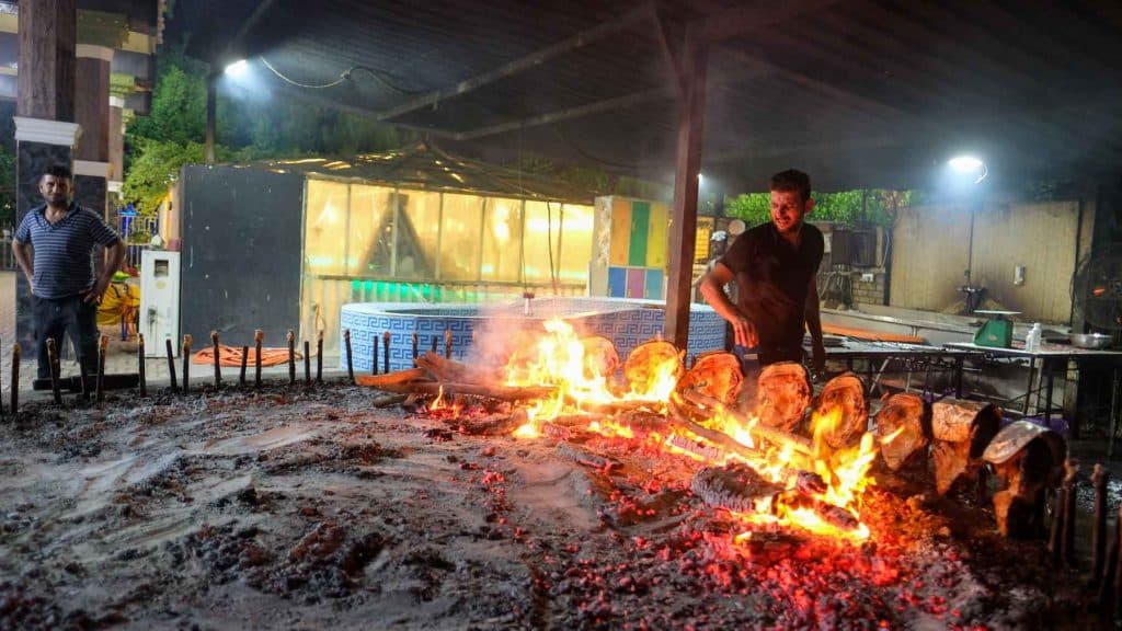 Cooking fish Masgouf in Iraq