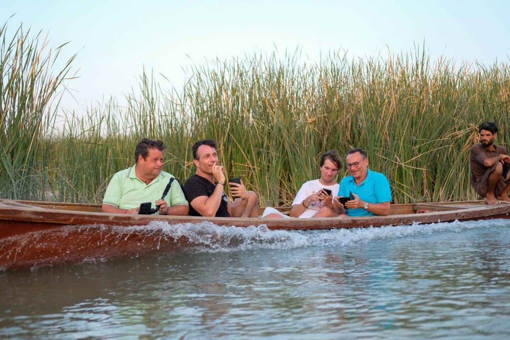 tourists enjoying a boat ride in the Iraqi marshlands